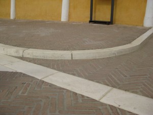 one of the curbs before the covered walkway