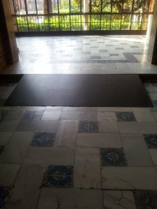 wheelchair ramp to mount step in marble tile floor with glazed tile pattern