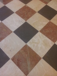 three colours of marble laid close in a regular pattern - no gaps